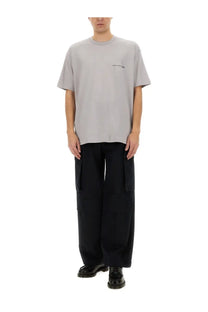 Comme des garcons shirt men’s minimalist gray crewneck t-shirt with small black embroidered logo on left chest