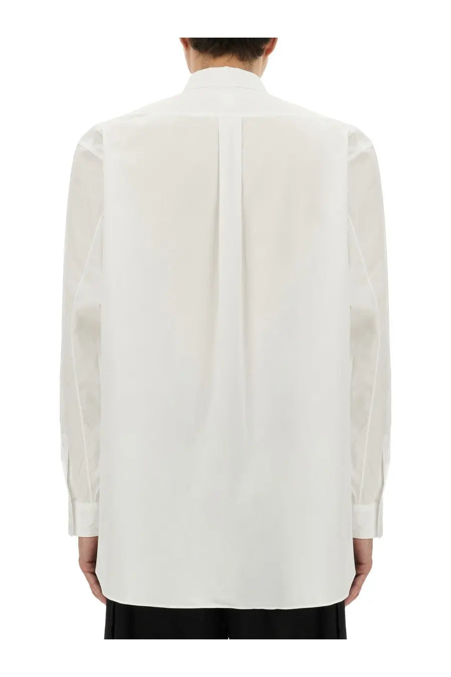 White poplin long-sleeved comme des garcons shirt with structured collar and subtle pleats on the back side
