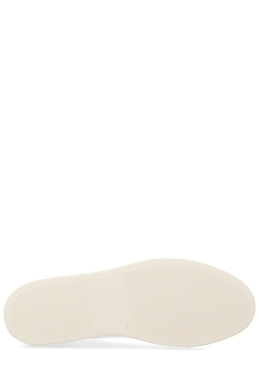 Cream-colored rubber sole with a smooth minimalist design on common projects mens sneaker achilles white