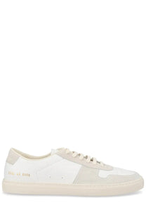 Common projects men’s sneaker bball white low-top sneaker with white and beige suede leather and gold branding on heel back side
