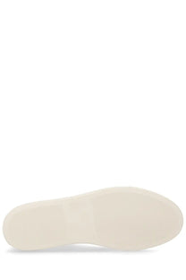 Cream-colored rubber sole with smooth minimalist design on common projects men’s sneaker bball white