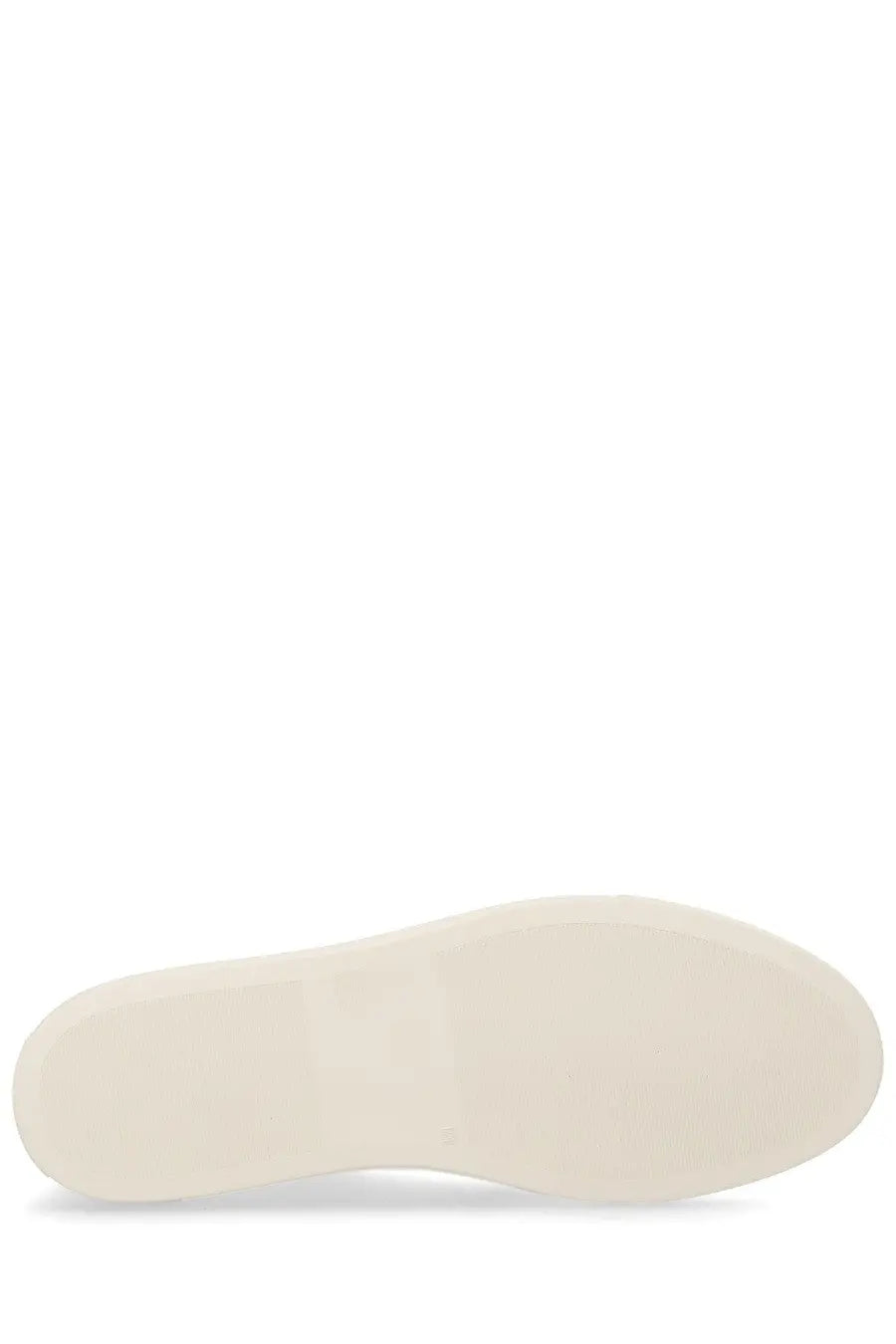 Cream-colored rubber sole of common projects men’s sneaker bball white with smooth minimalist design