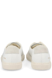 Common projects men’s sneaker bball white minimalist white leather sneakers with subtle beige heel tab accents back side
