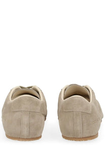 Common projects men’s sneaker in suede beige featuring beige suede slip-on design with light tan rubber soles