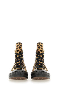 Converse unisex chuck hi sneaker with leopard print high tops black laces and glossy black rubber soles