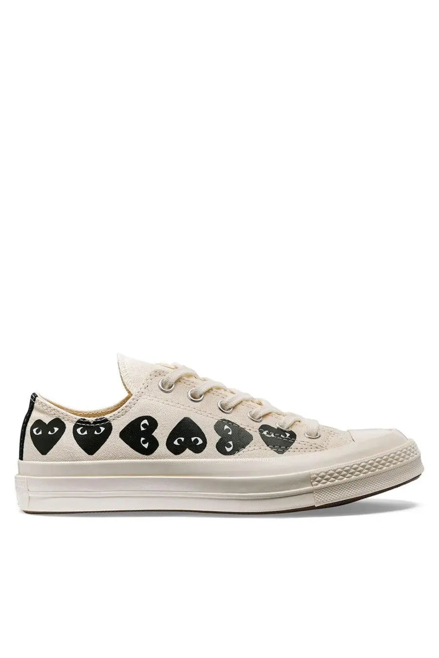 Cream-colored canvas low-top converse unisex chuck multi hearts sneaker with black heart-shaped eyes by comme des garçons