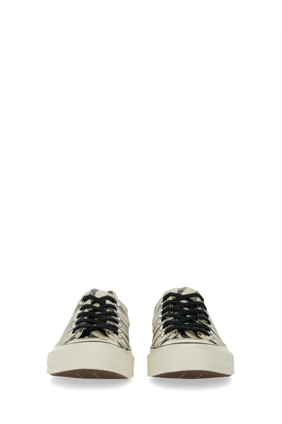 Beige canvas Converse unisex Chuck OX low-top sneakers with black laces and chunky white rubber soles