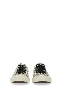 Beige canvas Converse unisex Chuck OX low-top sneakers with black laces and chunky white rubber soles