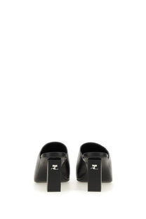 Courrèges women’s sleek black leather mules with a minimalist design and block heel
