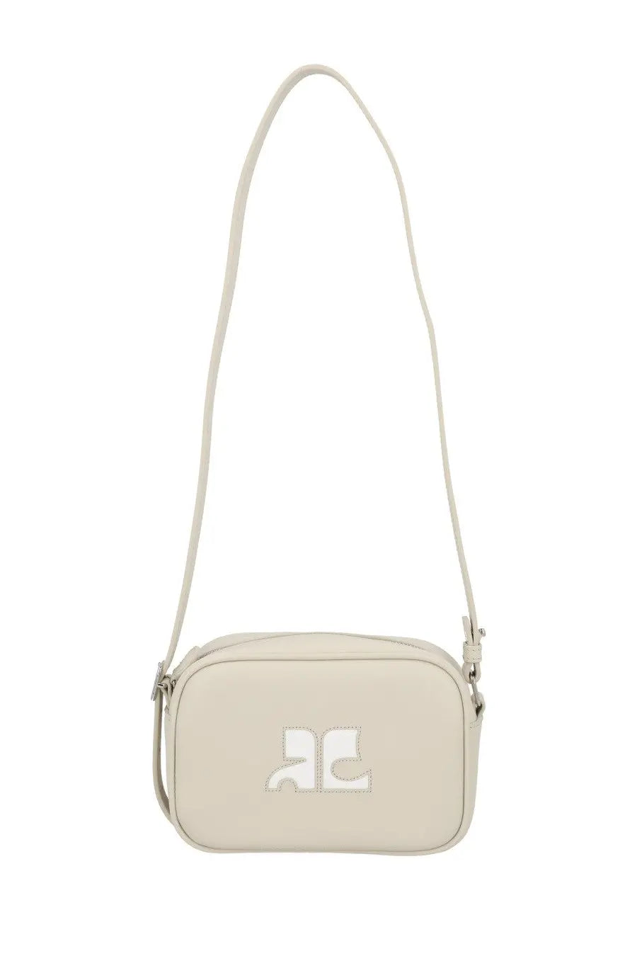 Cream-colored courrèges reedition naplack crossbody bag with minimalist logo patch and slender adjustable strap in beige