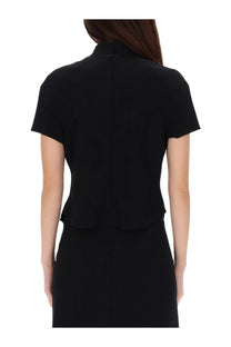 Courrèges women’s black short-sleeved dress with high collar and peplum hem in heritage circle design