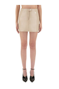 Beige faux leather mini skirt with front zipper and button closure from courrèges women vinyl reedition collection