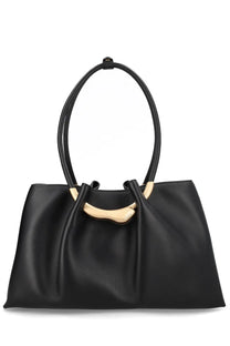 Black leather tote bag with gold-tone circular handles and curved metal accent Cult Gaia women’s bag Asa black