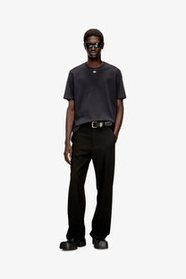 Black balenciaga belt with silver toned logo buckle paired with diesel mens black cotton blend shirt