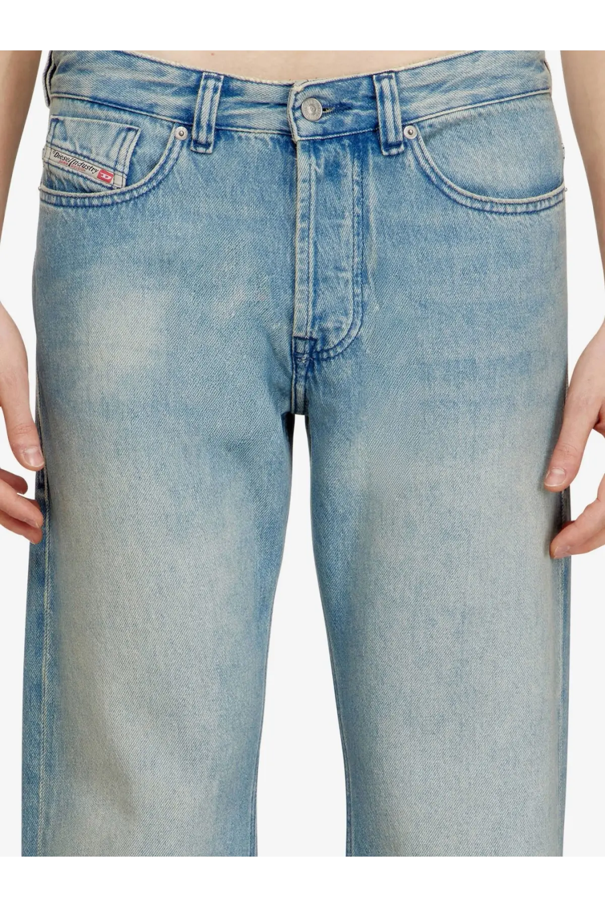 Back view of diesel men’s eeper blue light-wash denim jeans with faded worn look and diesel label on the pocket