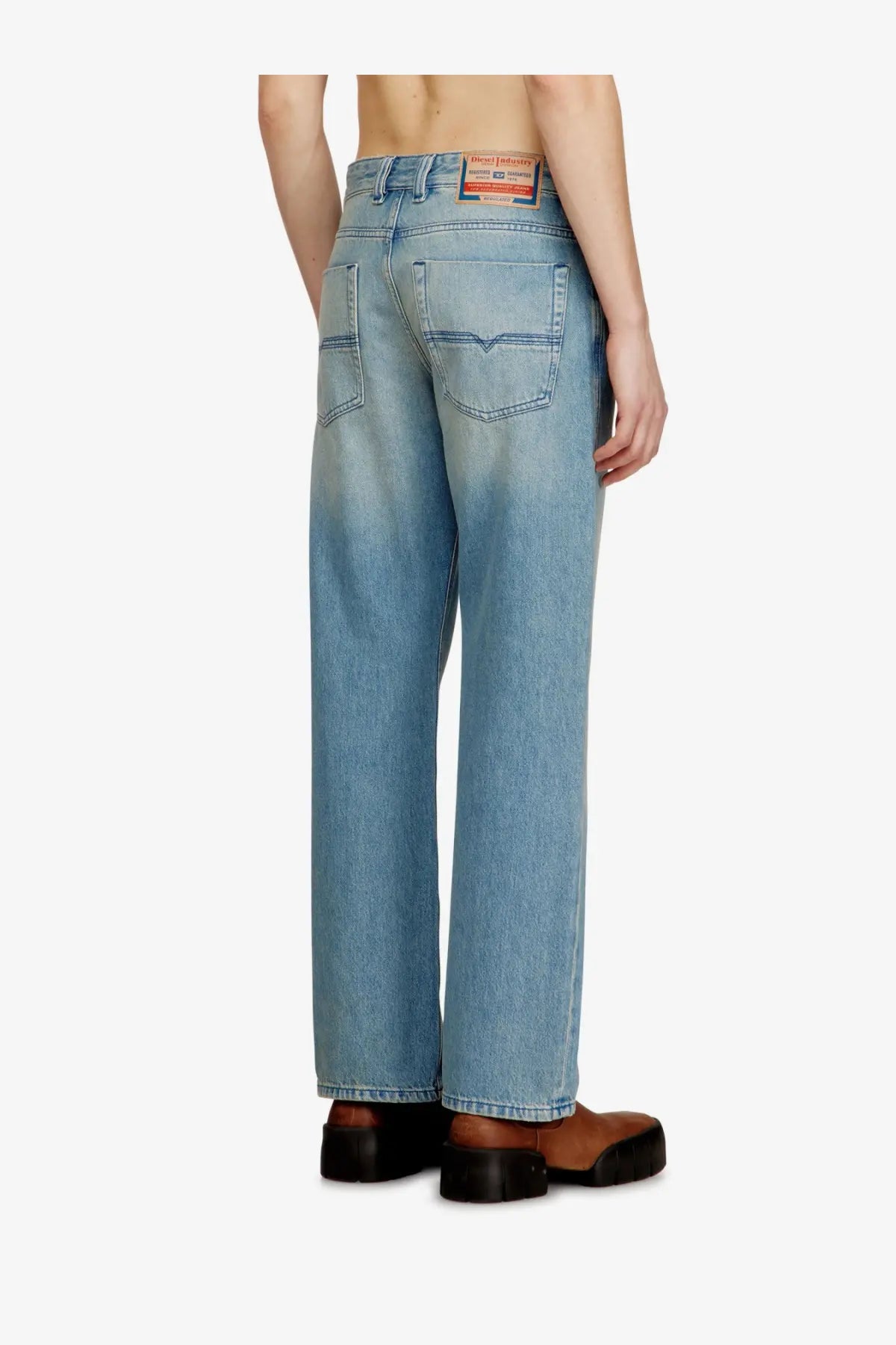 Diesel men’s Eeper blue denim jeans light wash with relaxed straight-leg cut and visible Diesel label at waistband