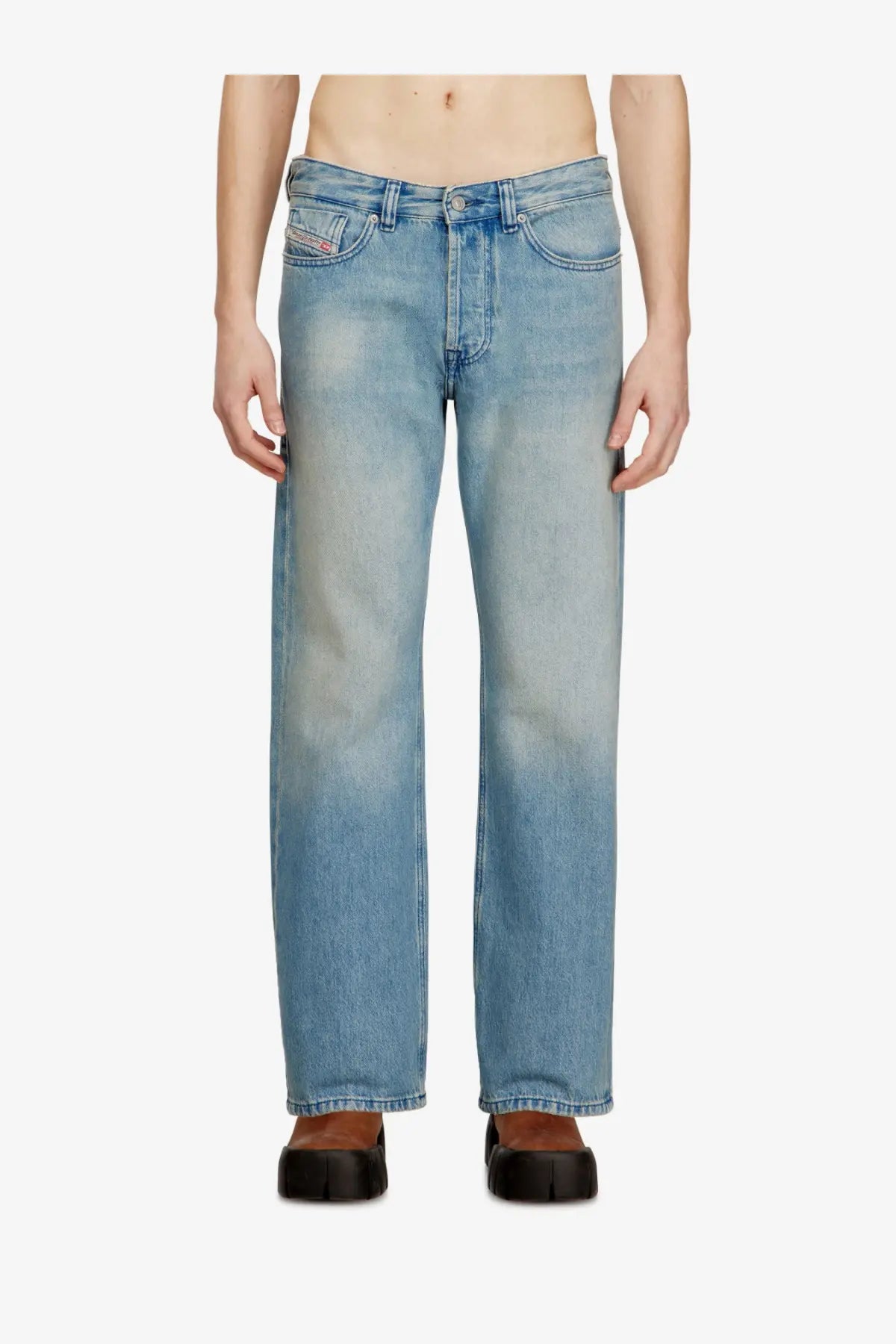Back side of diesel mens eeper blue light-wash denim jeans with straight-leg cut and subtle fading showing brand logo