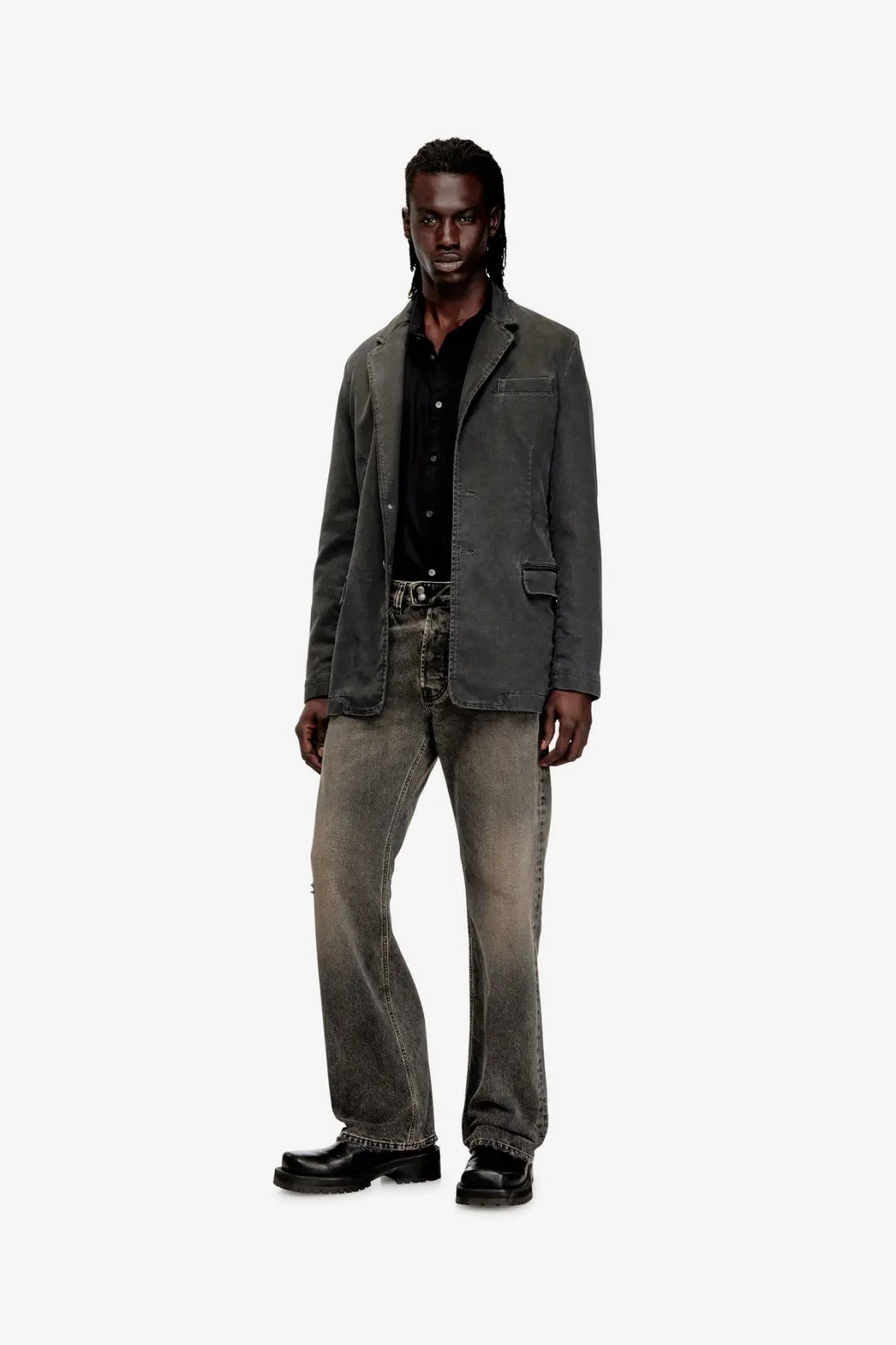 Dark gray denim blazer with classic fit and subtle distressing paired with diesel men’s black denim trousers