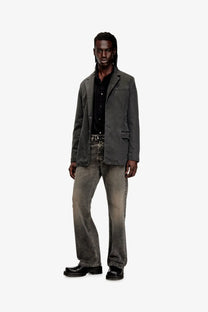 Dark gray denim blazer with classic fit and subtle distressing paired with diesel men’s black denim trousers