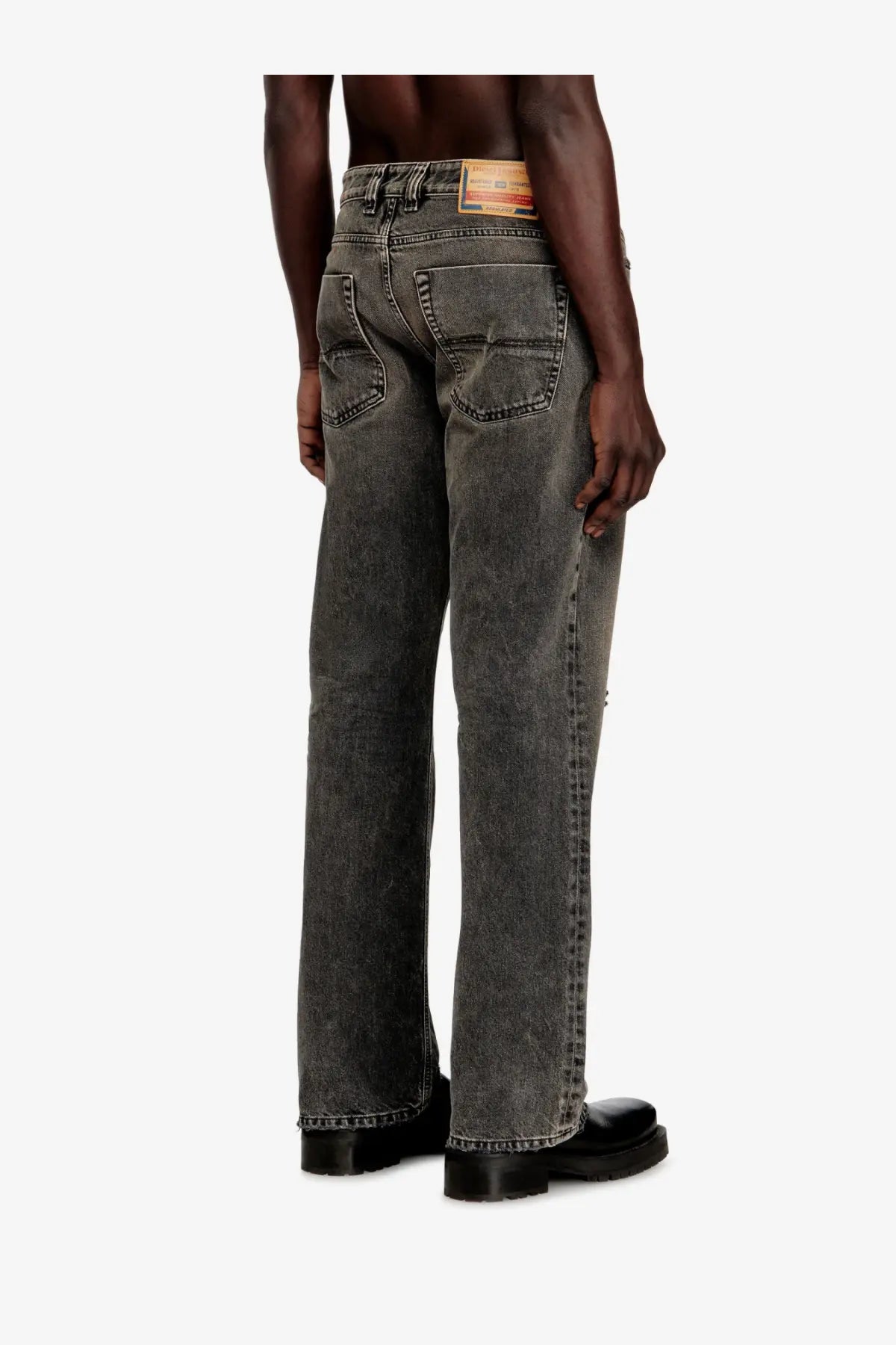 Dark gray faded denim jeans with relaxed fit and classic back pockets shown from the back by diesel men’s eeper ra