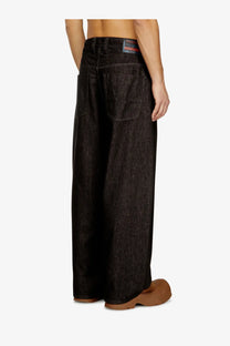 Diesel men’s black wide-leg denim trousers with subtle textured pattern and branded label at the waistband