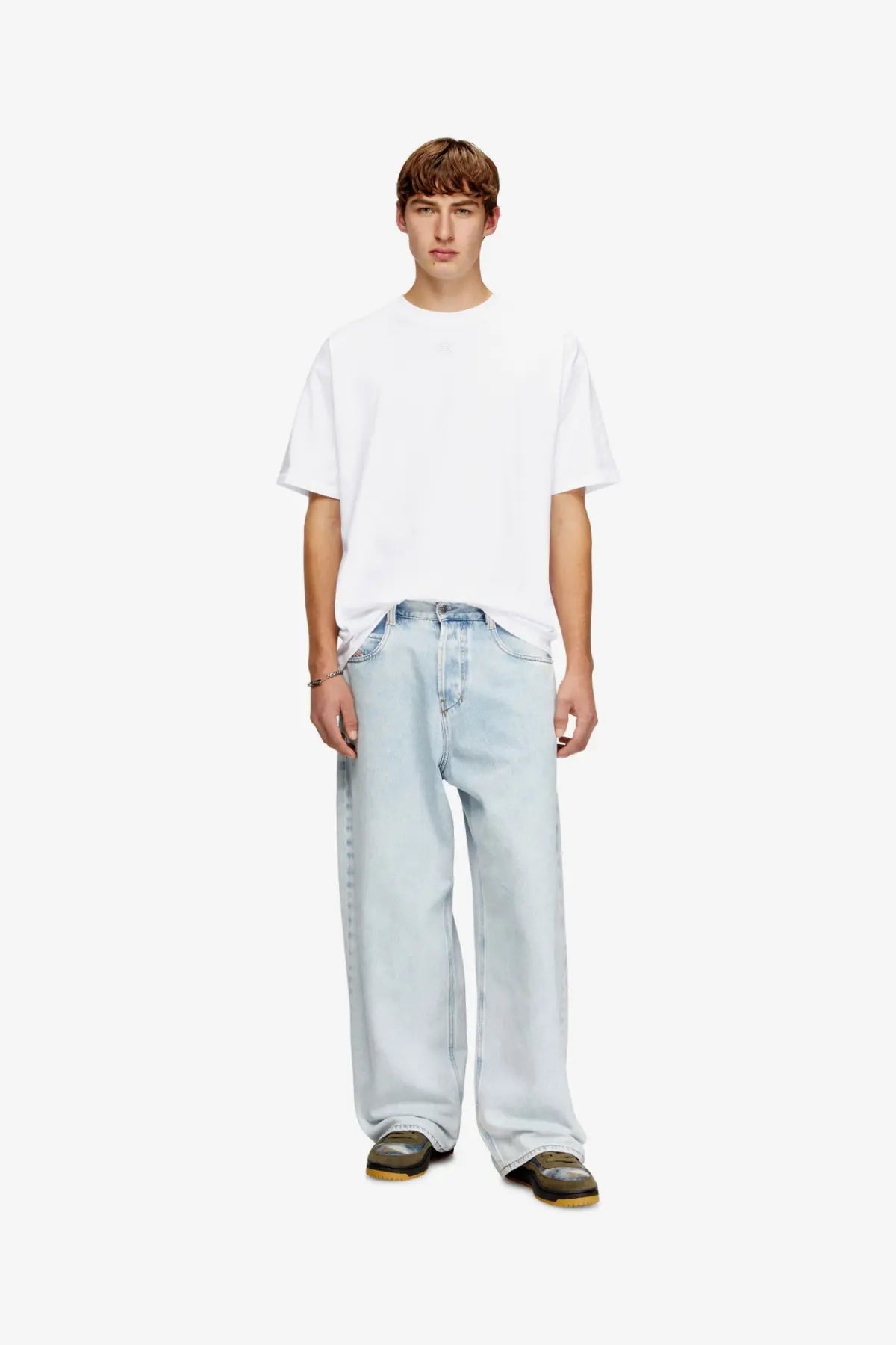 Light-wash denim jeans with a relaxed wide-leg cut paired with a diesel men’s lucien ihbi cotton shirt white