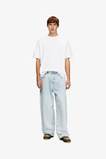 Light-wash denim jeans with a relaxed wide-leg cut paired with a diesel men’s lucien ihbi cotton shirt white