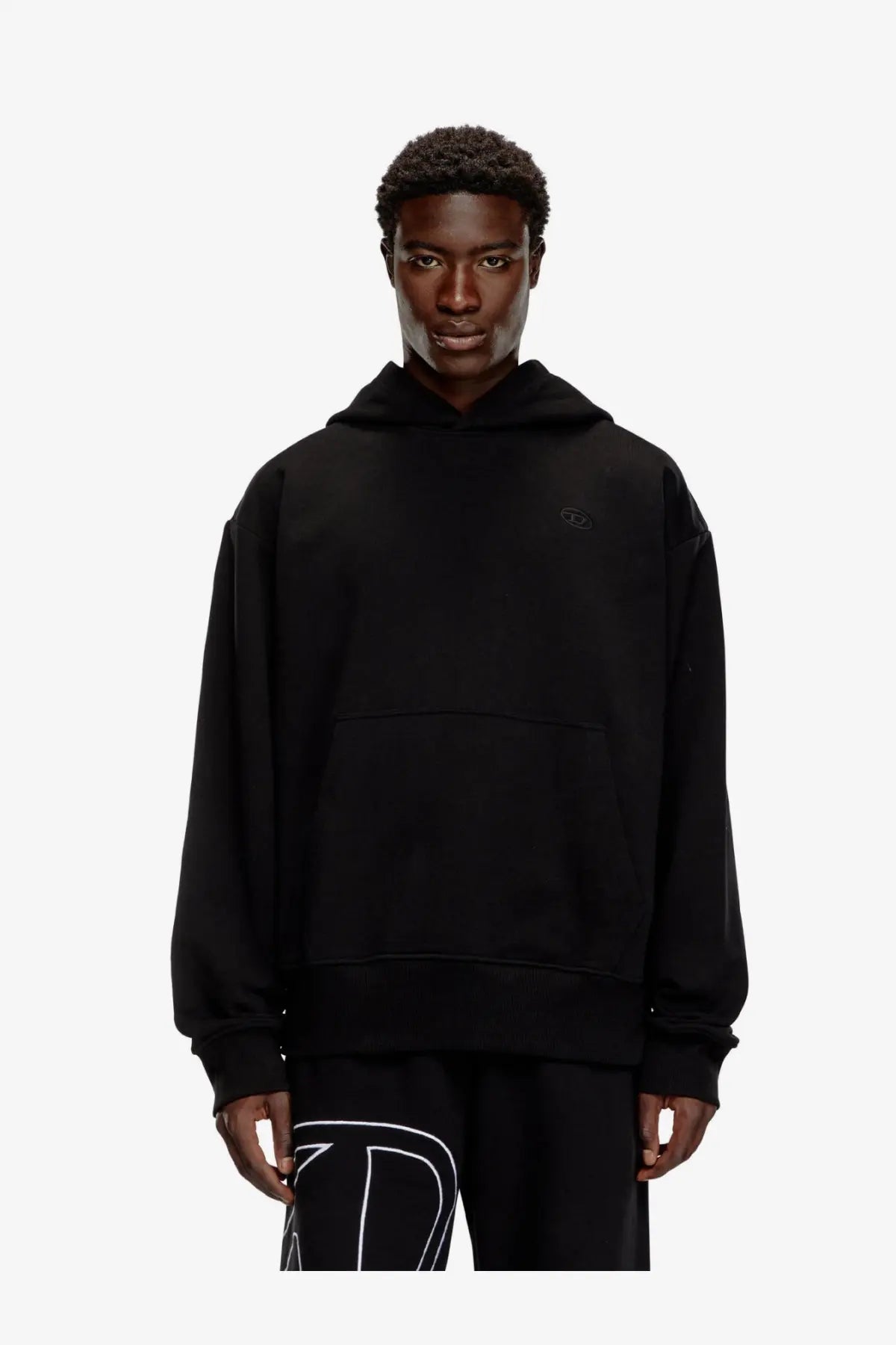 Diesel men’s black cotton sweatshirt featuring an oversized hoodie with a subtle embroidered chest logo