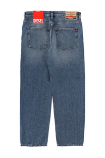 Blue denim men’s jeans with faded wash and red diesel brand tag on waistband from diesel macs collection