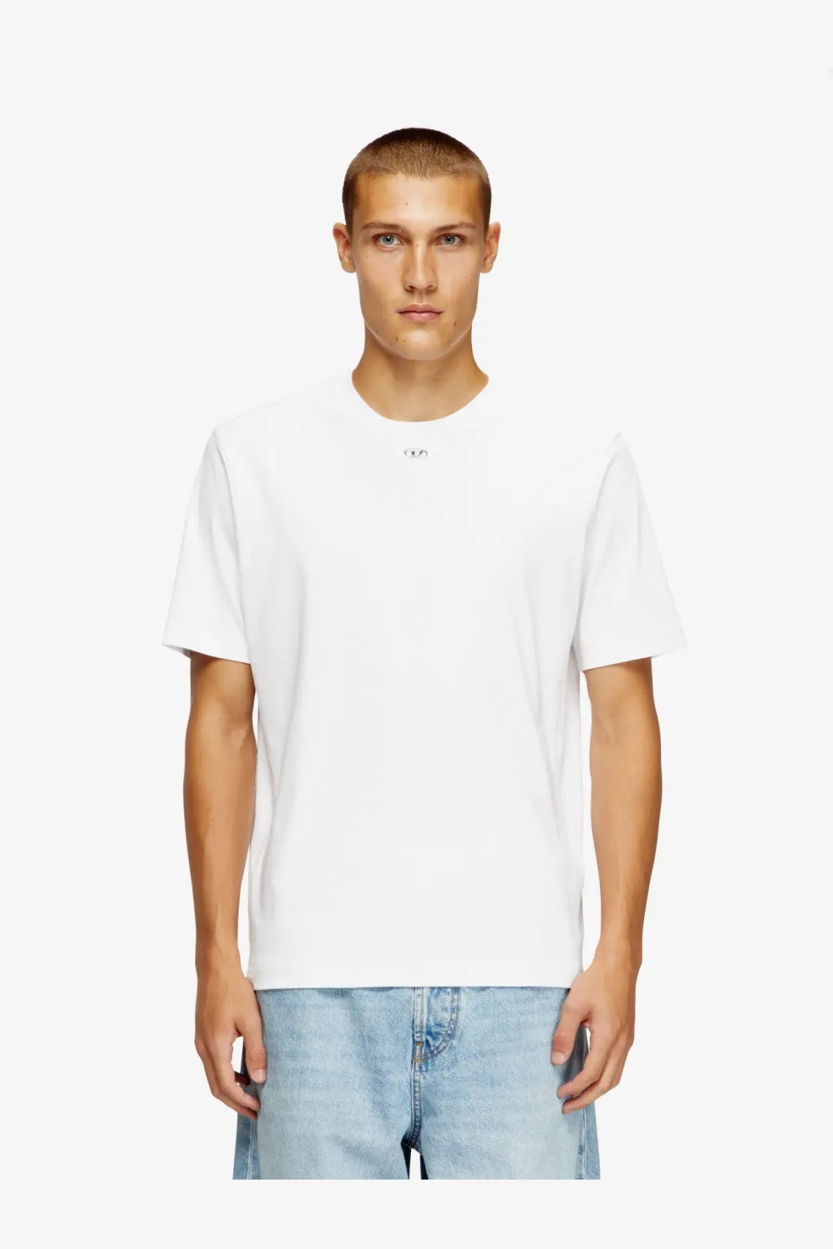 White cotton crewneck t-shirt with a small minimalist logo at the neckline from diesel mens madjust tr cotton shirt white