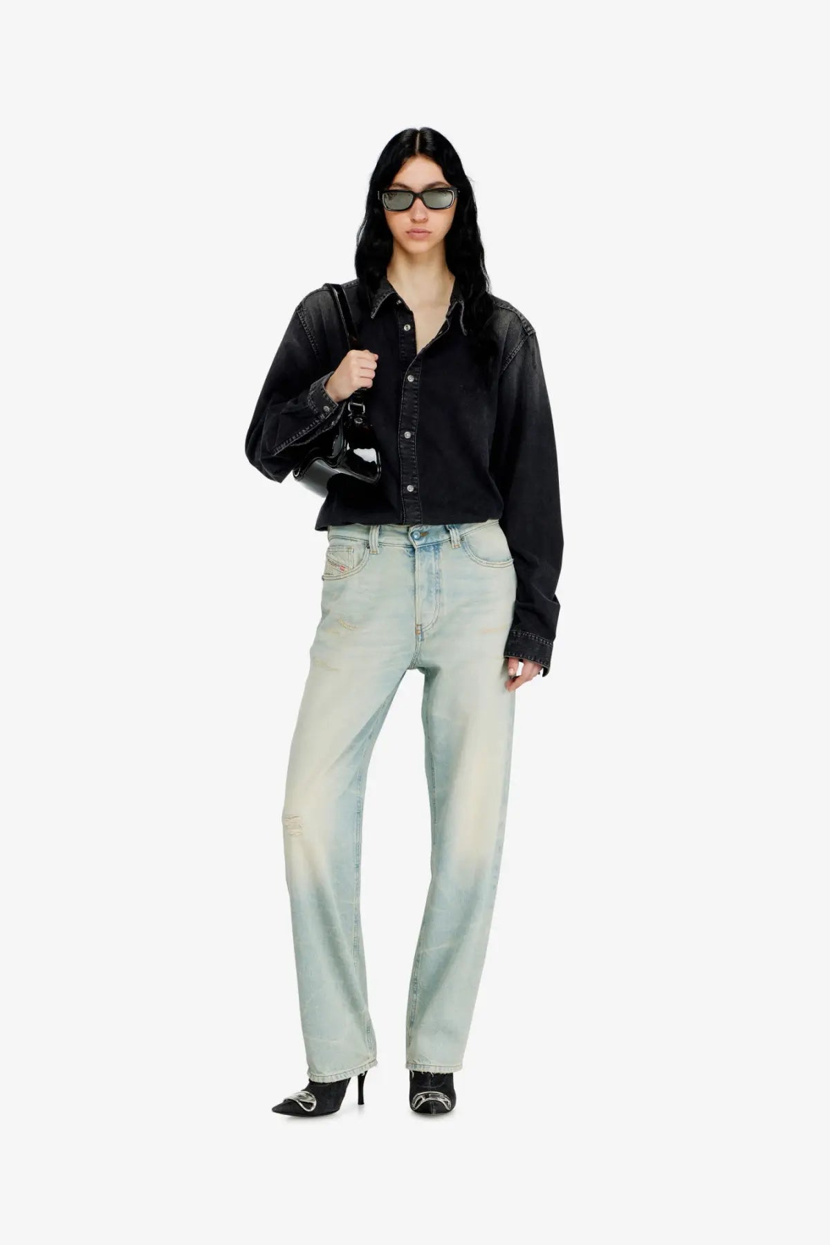 Diesel women’s ark jeans in washed out blue denim feature a light-wash, straight-leg cut with subtle fading