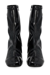 Diesel women’s black ankle boots in patent leather with a glossy finish and square toe design
