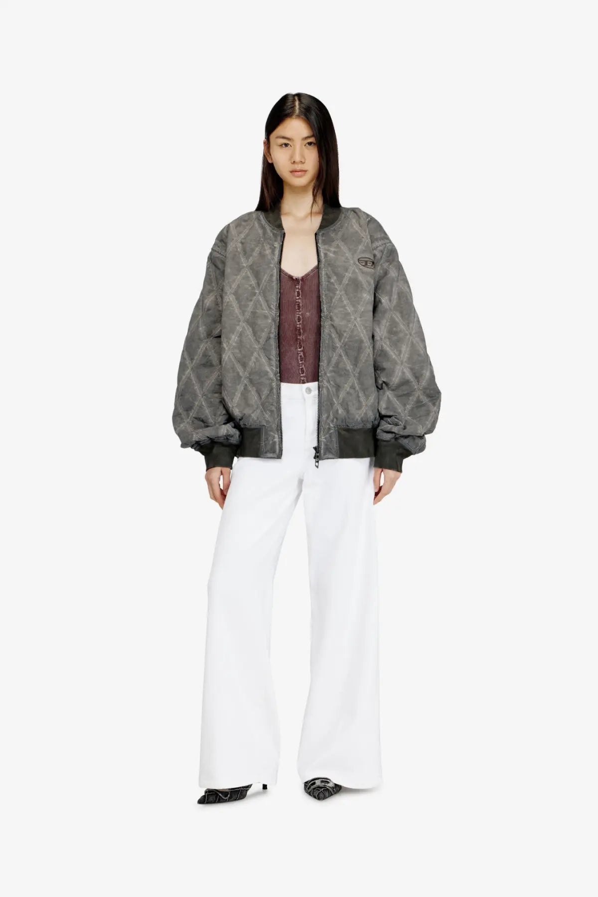Gray quilted bomber jacket with a subtle geometric pattern and black ribbed cuffs paired with diesel women’s white cotton blend trousers