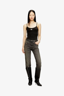 Black denim jeans with faded wash and classic five-pocket design paired with diesel women’s black cotton tank top