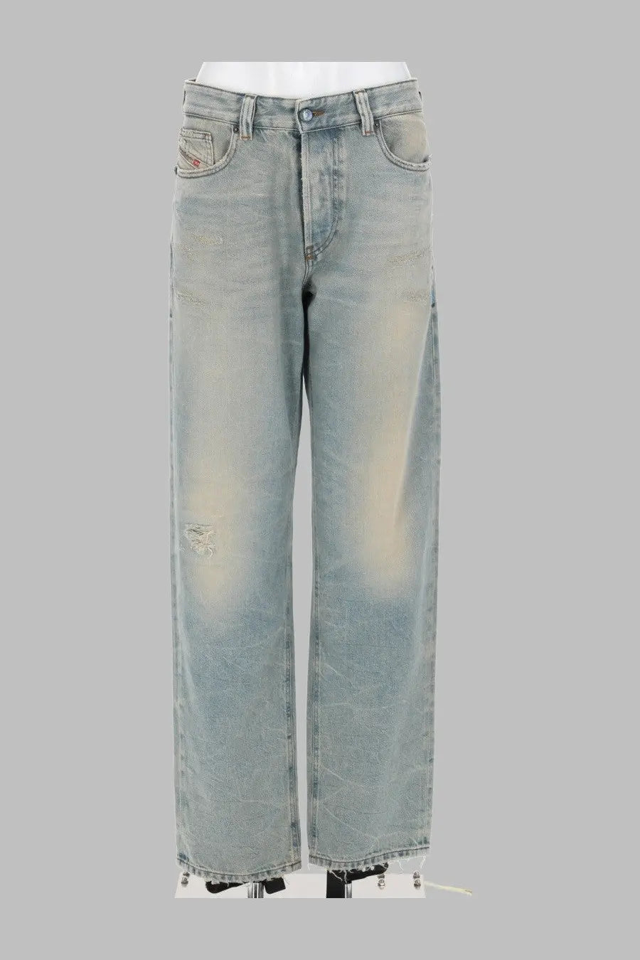 Light-wash denim Diesel women’s jeans ark blue with a distressed faded look and frayed hems front view