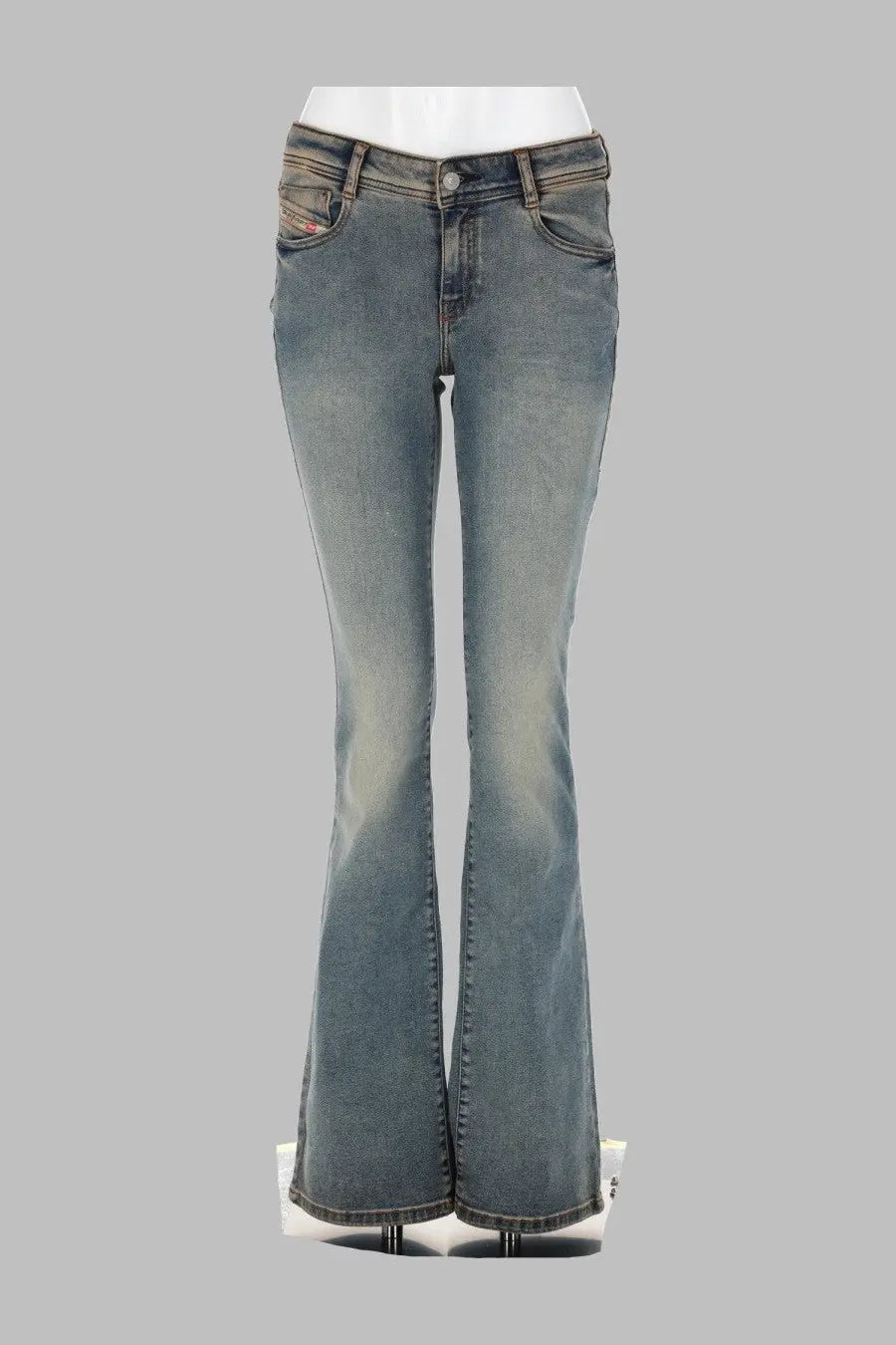 A pair of medium-wash denim flare jeans with a classic five-pocket design and subtle fading.