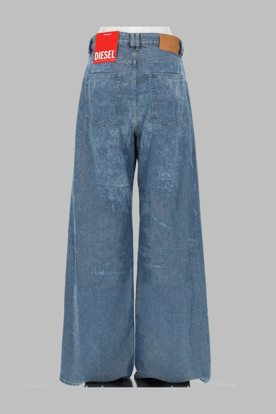 Diesel women’s jeans sire relaxed blue wide-leg denim pants with red diesel label and brown leather patch at waistband