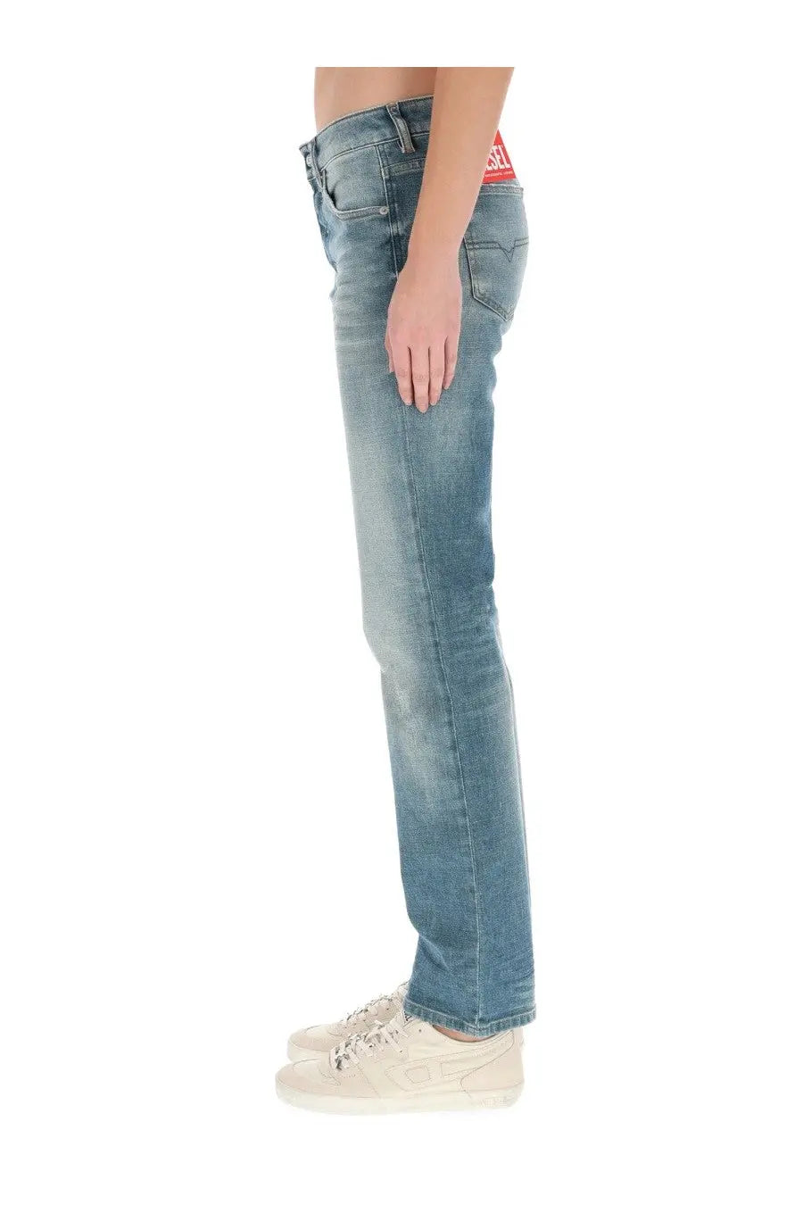 Diesel women’s mine light-wash denim jeans with red diesel brand label at the waistband in blue