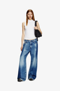 Wide-leg blue denim jeans with faded wash and frayed hems paired with diesel women’s mokky ls microdiv stretch viscose tank top white