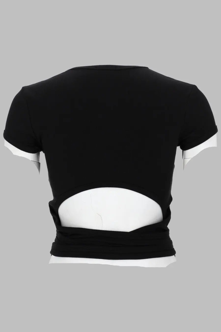 Back view of diesel women’s black cropped costine con lacci shirt with white sleeve trim and lower back cutout revealing inner layer