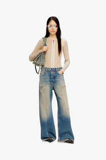 Diesel women’s sire wide-leg distressed denim jeans in faded blue with frayed hem and vintage wash