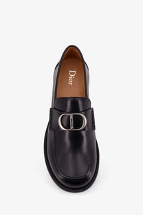 Dior men’s Archie leather loafers in black with shiny leather finish and silver cd logo buckle