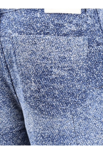 Dior men’s carpenter jacquard jeans in blue with white speckled textured fabric and visible front pocket