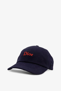 Navy blue Dior men’s cotton baseball cap with red embroidered logo in a stylish casual design