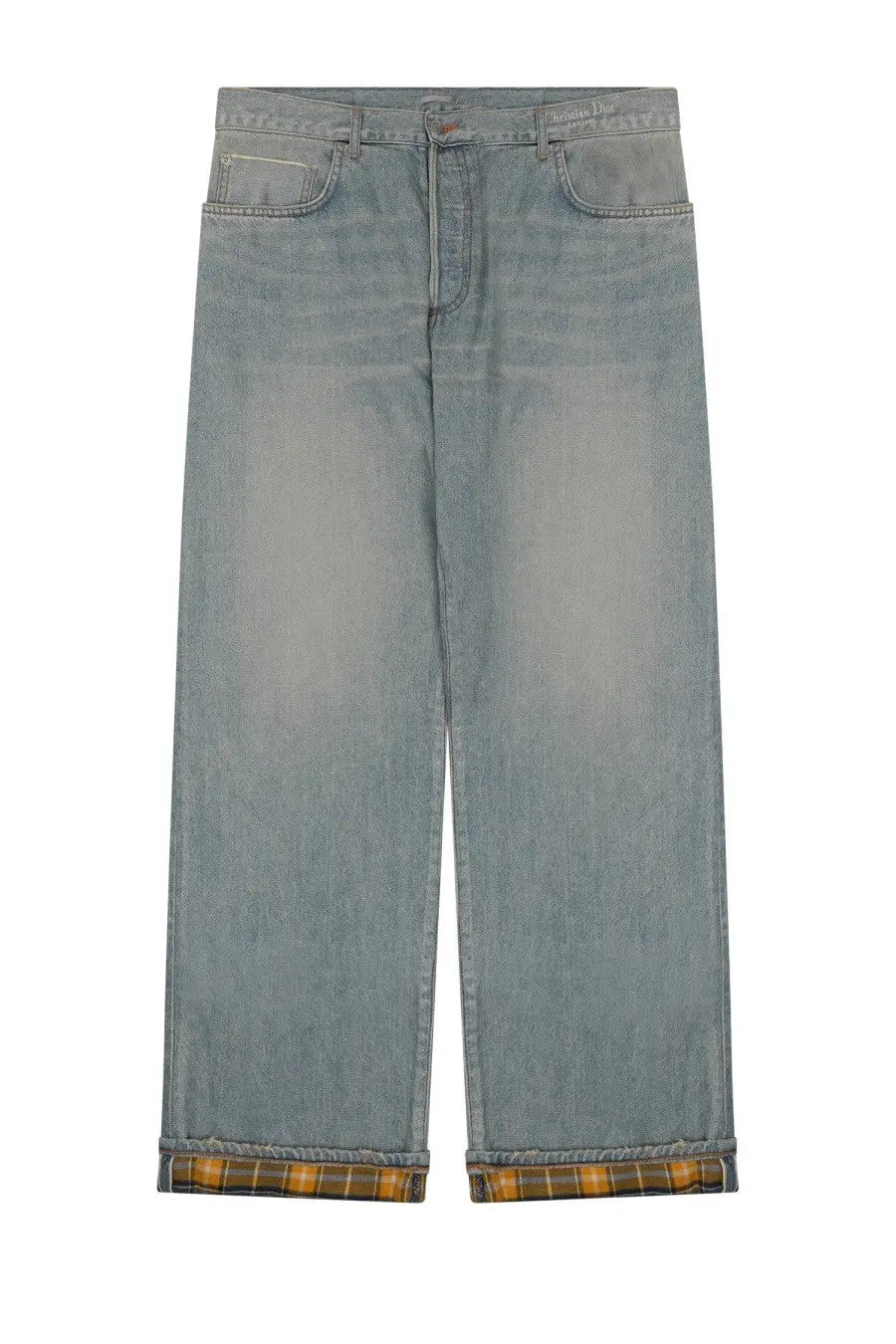Light-wash denim Dior men’s heritage jeans with wide-leg cut and plaid lining visible at rolled cuffs