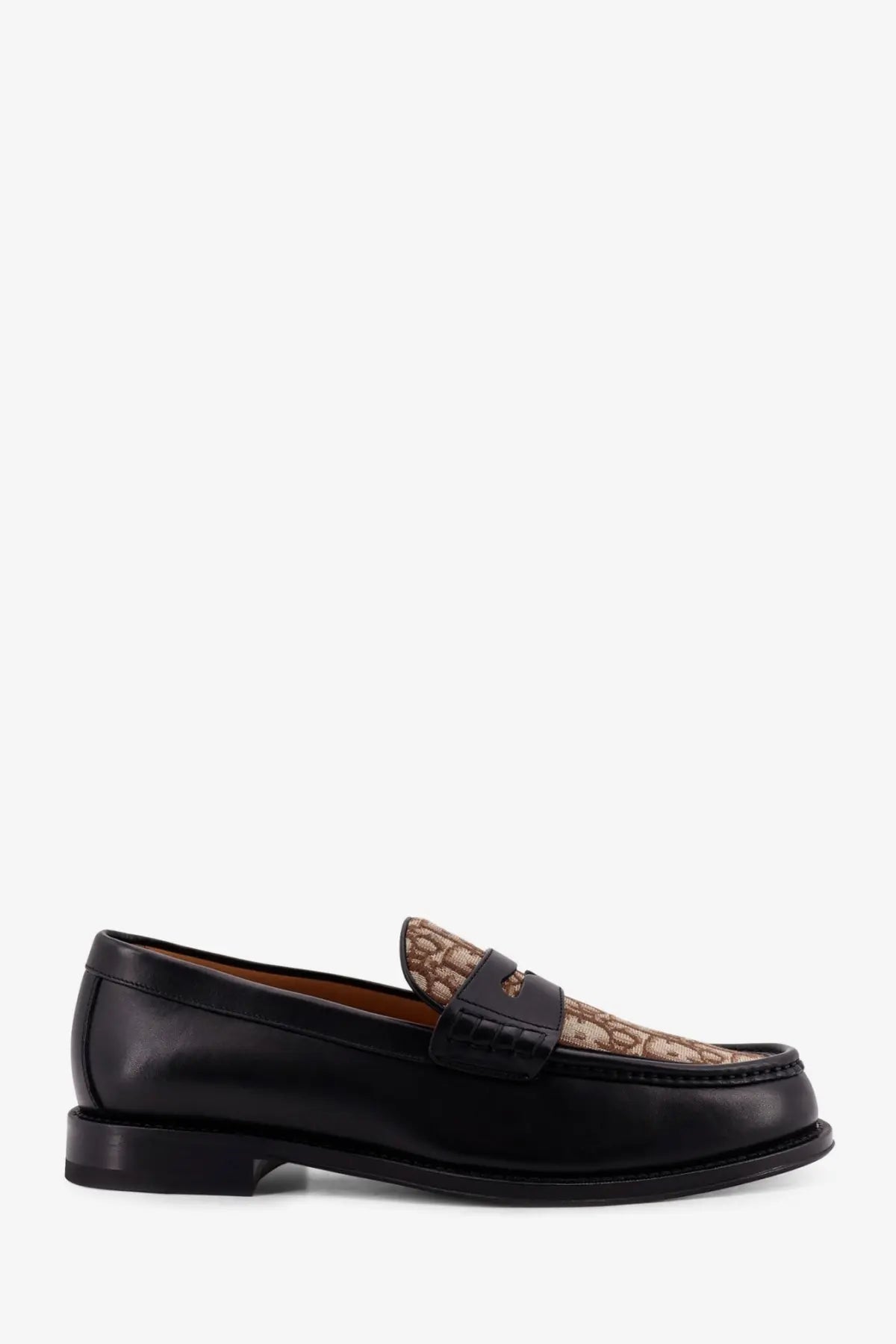 Dior men’s black leather loafers with tan and brown patterned toe cap featuring the Coach logo