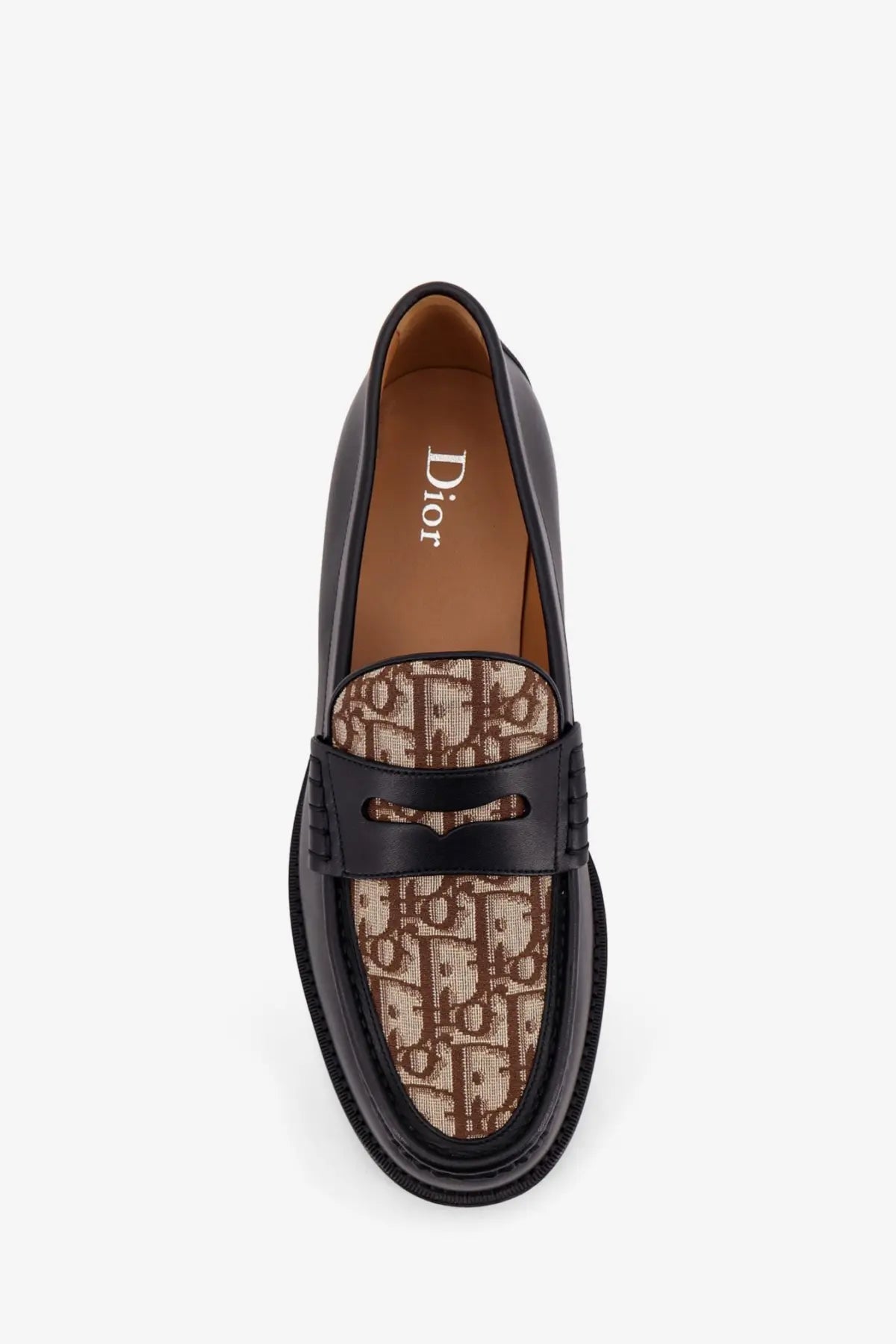 Dior men’s leather loafers black featuring a tan and brown monogram canvas panel across the toe