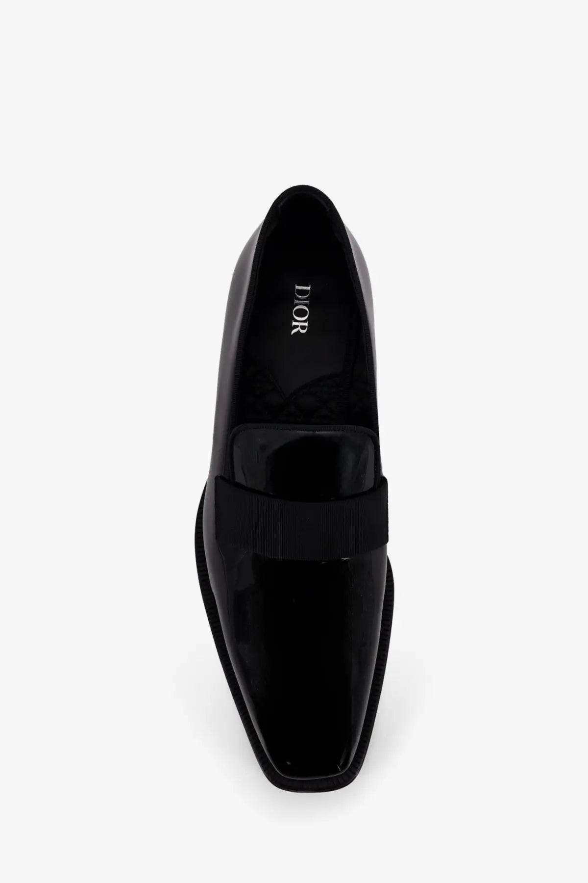 Black patent leather Dior men’s Palmarè loafers with sleek square toe and contrasting ribbed strap across the vamp