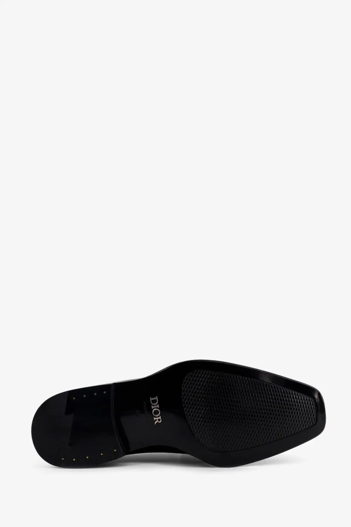 Black dior men’s palmarè patent leather loafers sole with glossy finish and textured pattern visible from back side