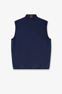 Navy blue Dior men’s sleeveless jacket with high collar and subtle stitching details in lightweight fabric